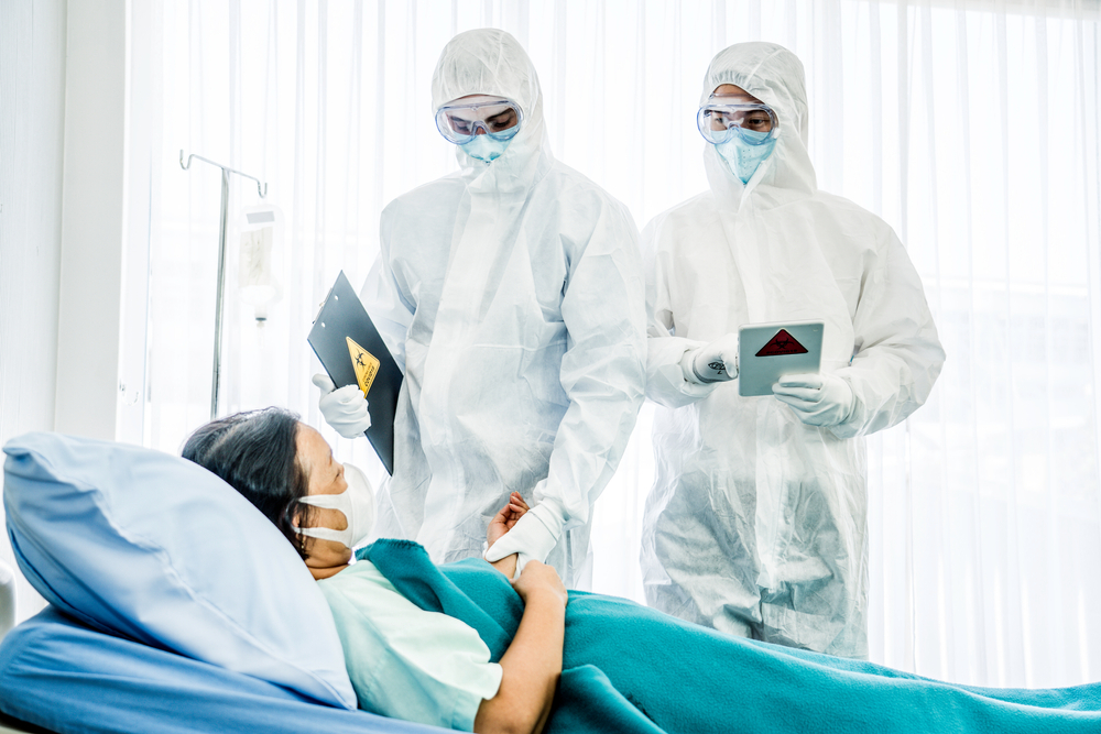 Doctors Examining Infected Patient